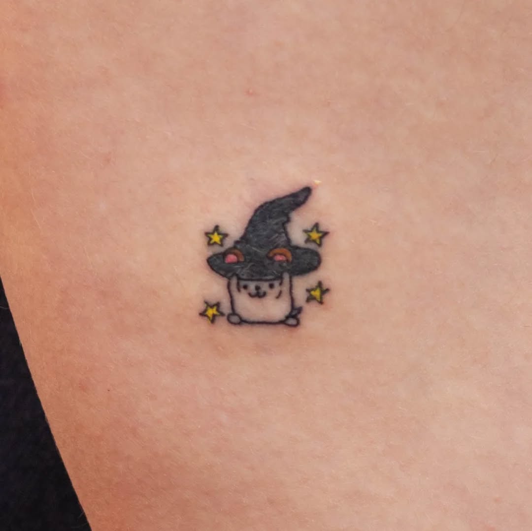 Adorable hamster in a witch hat tattoo
