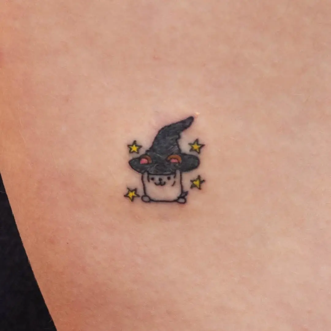 Adorable hamster in a witch hat tattoo