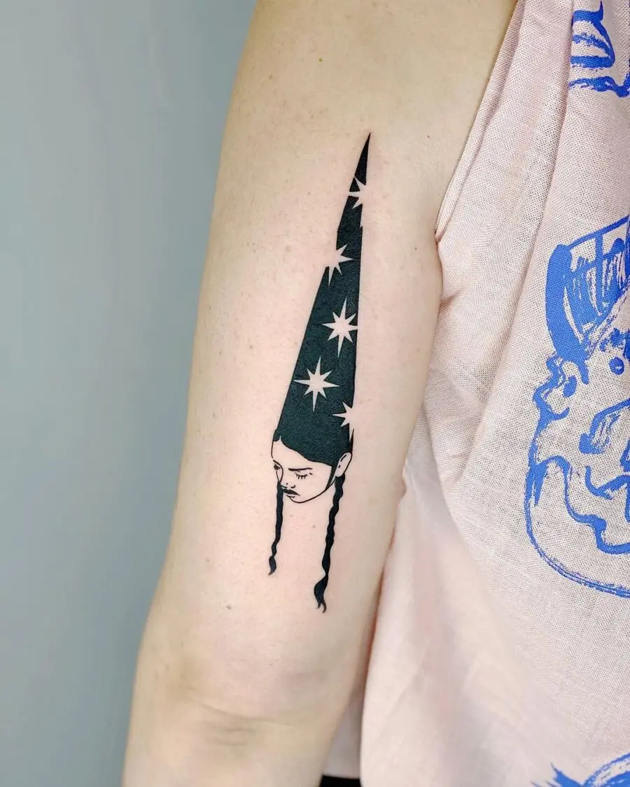 Unique witch hat tattoo with star accents