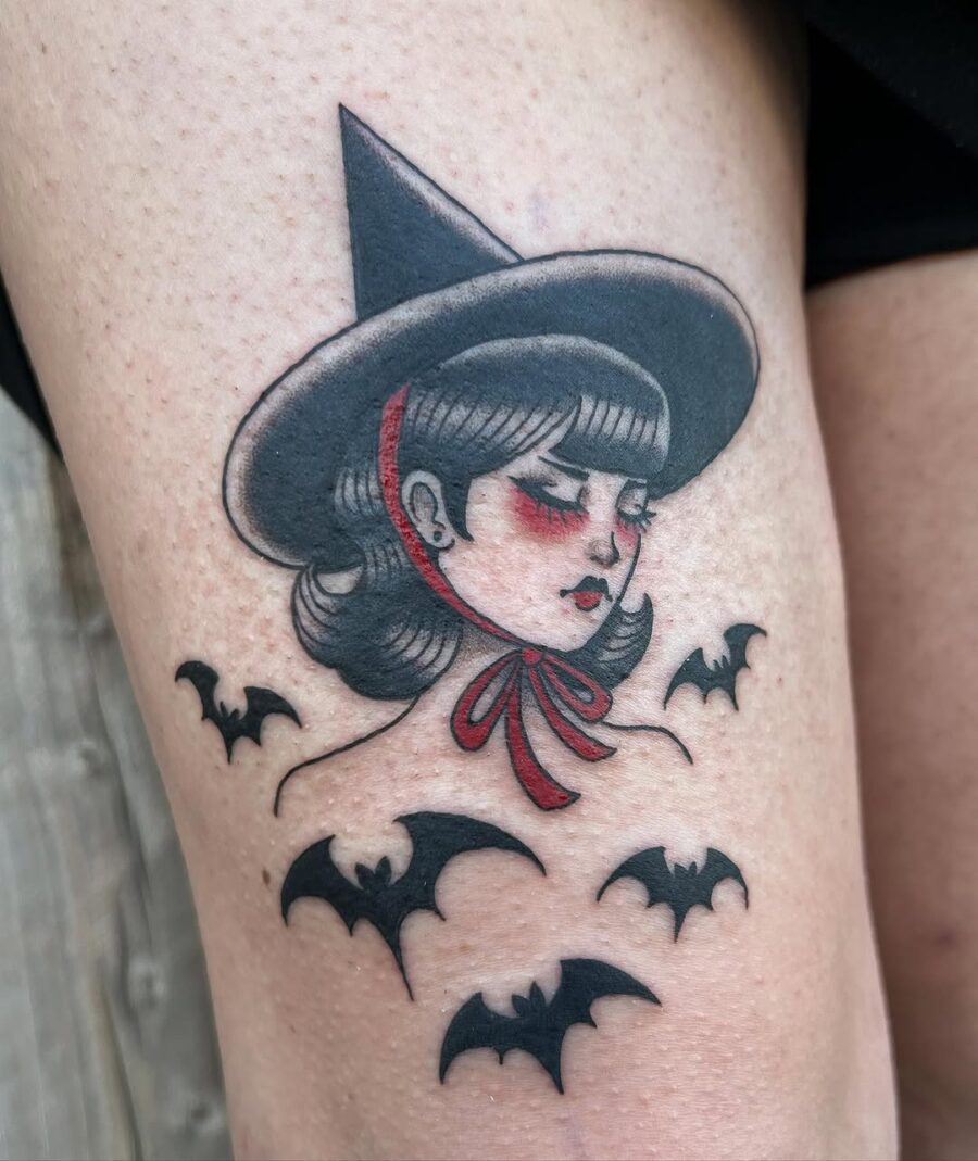 Enchanting witch hat tattoo with bat accents