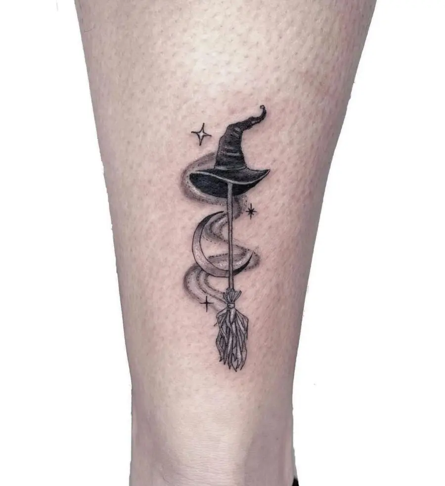 Elegant witch hat tattoo featuring celestial elements