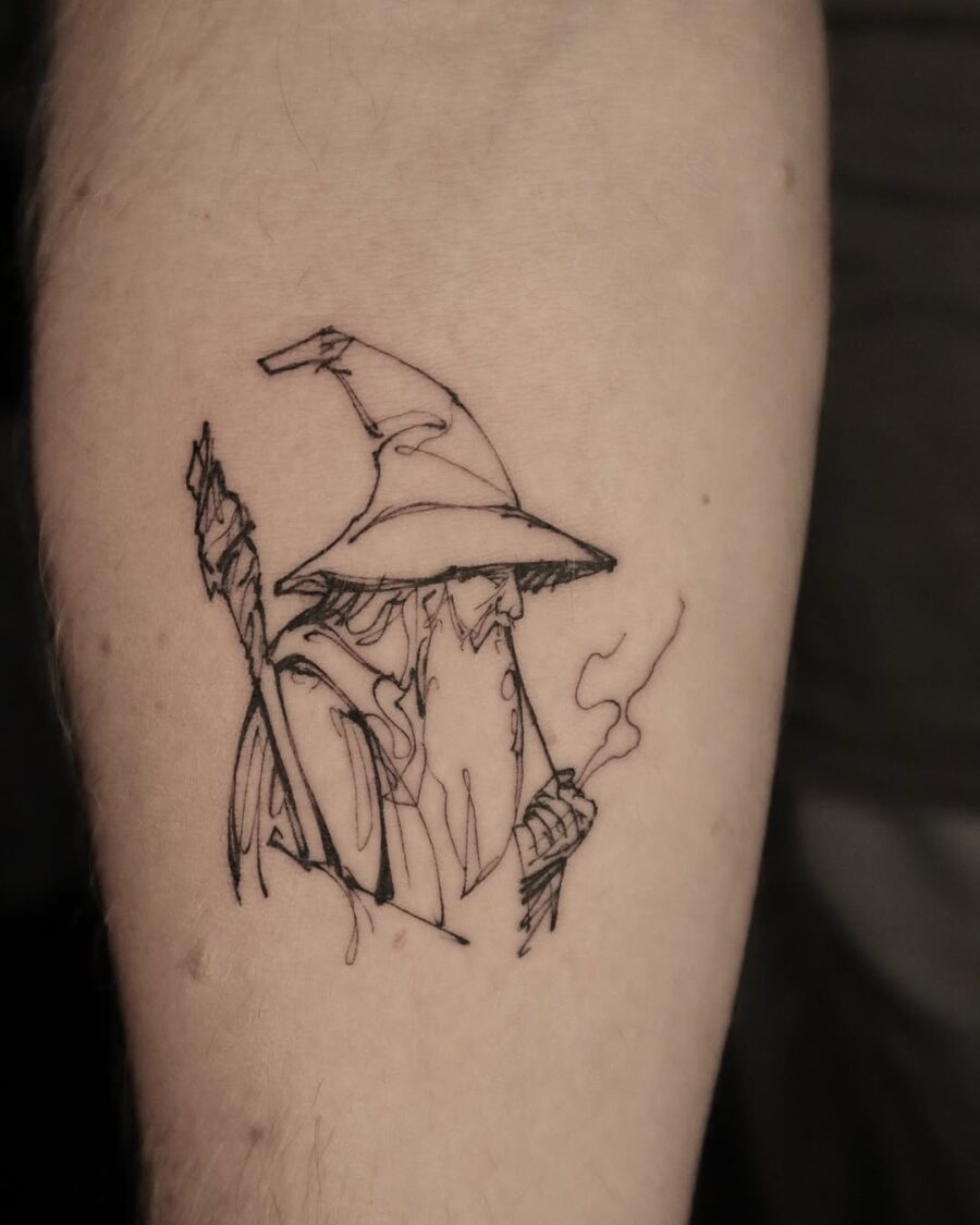 Wizardly charm captured in minimalist tattoo art