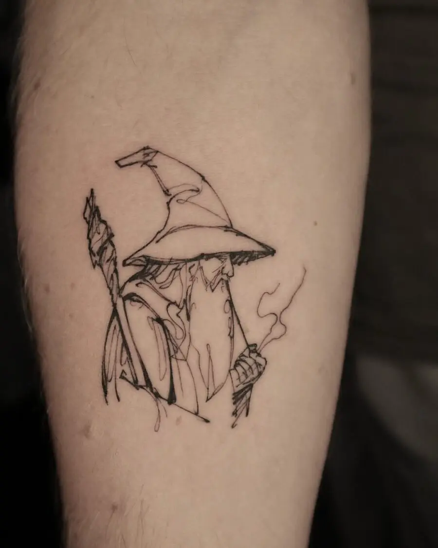 Wizardly charm captured in minimalist tattoo art