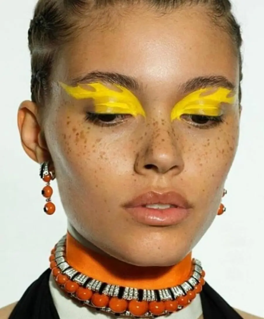 Vibrant yellow eyelids with bold accents