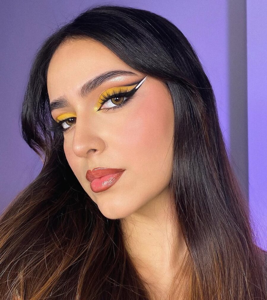 Vibrant yellow glam with bold winged eyeliner