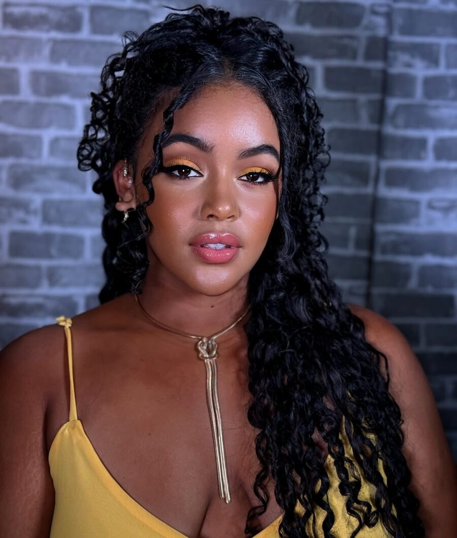 Striking yellow makeup with curly hair vibes