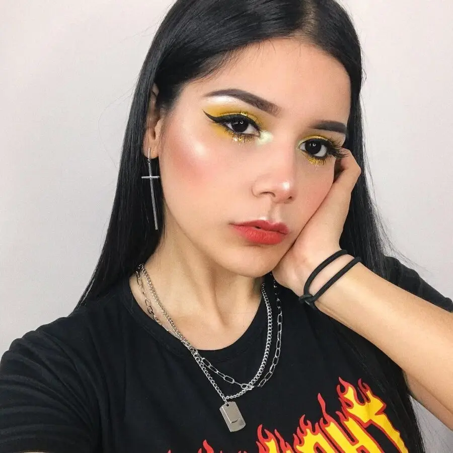 Vibrant yellow eye makeup with soft highlights