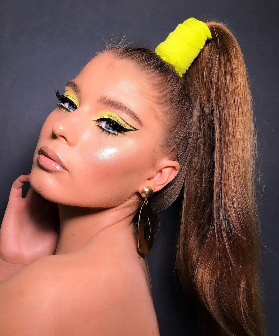 Vibrant yellow makeup with striking highlights