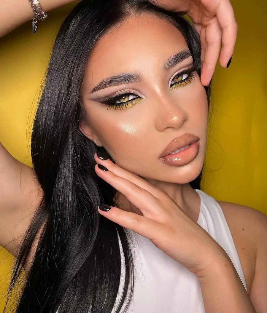 Vibrant yellow accent makeup for striking eyes.