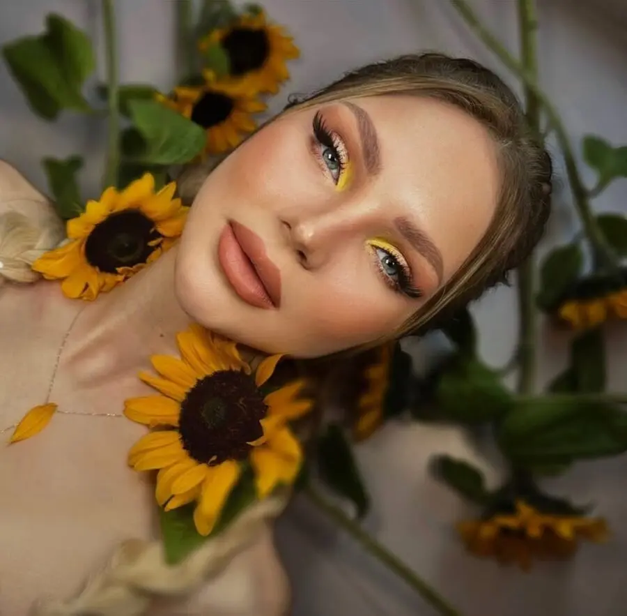 Radiant yellow makeup with sunflower accents