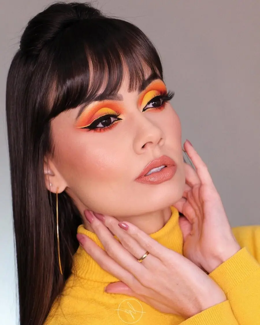 Vibrant yellow and orange sunset eye makeup