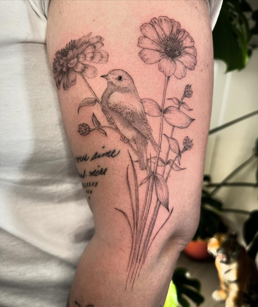 Elegant zinnia and bird tattoo design