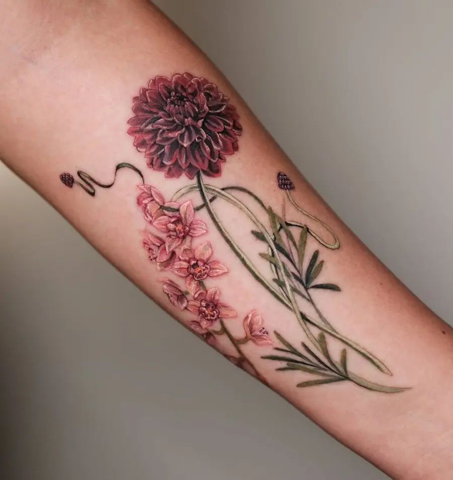 Vibrant zinnia and floral tattoo design