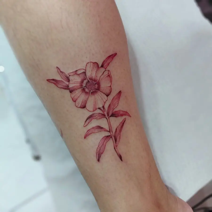 Stunning zinnia tattoo in vibrant red hues