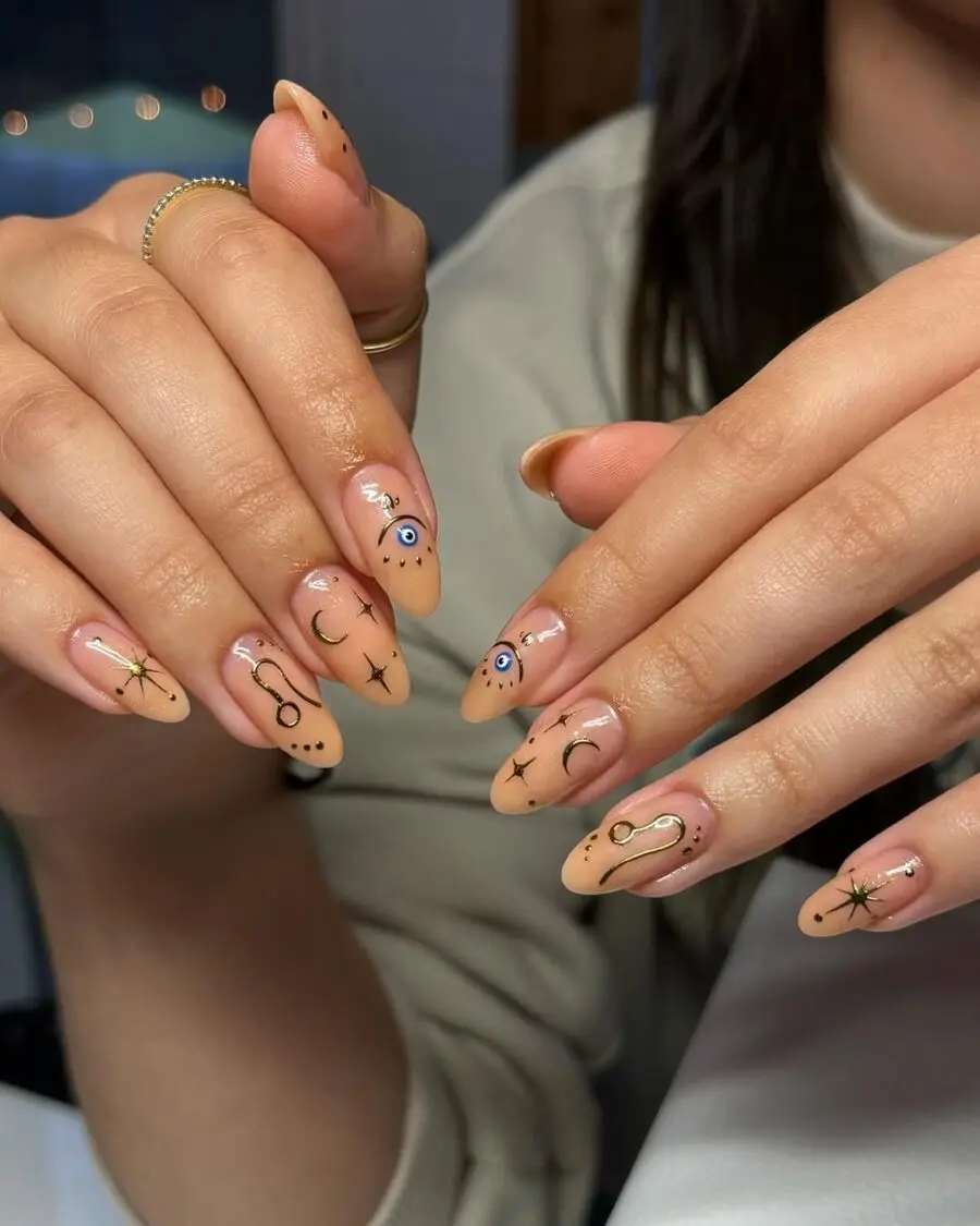 Stylish zodiac nail art with earthy shades