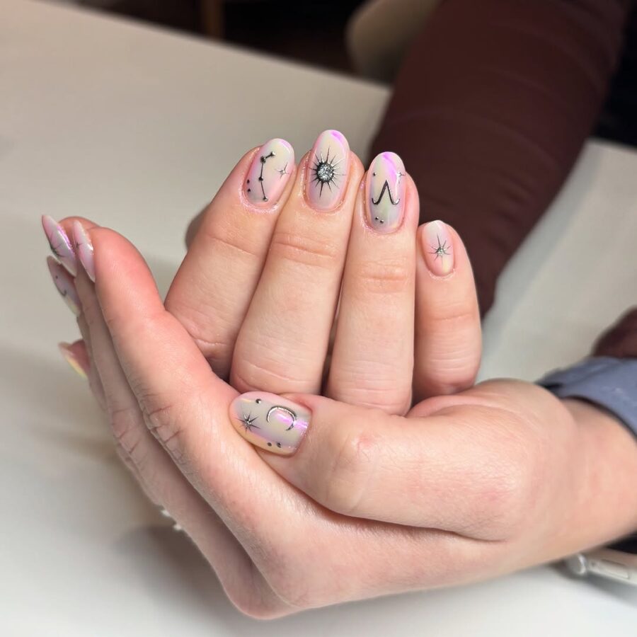 Celestial-inspired nails with chic elegance