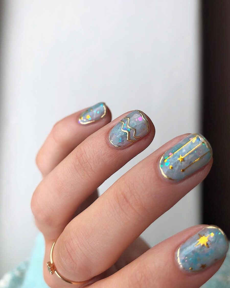 Aquarius-Inspired Nails with Celestial Accents