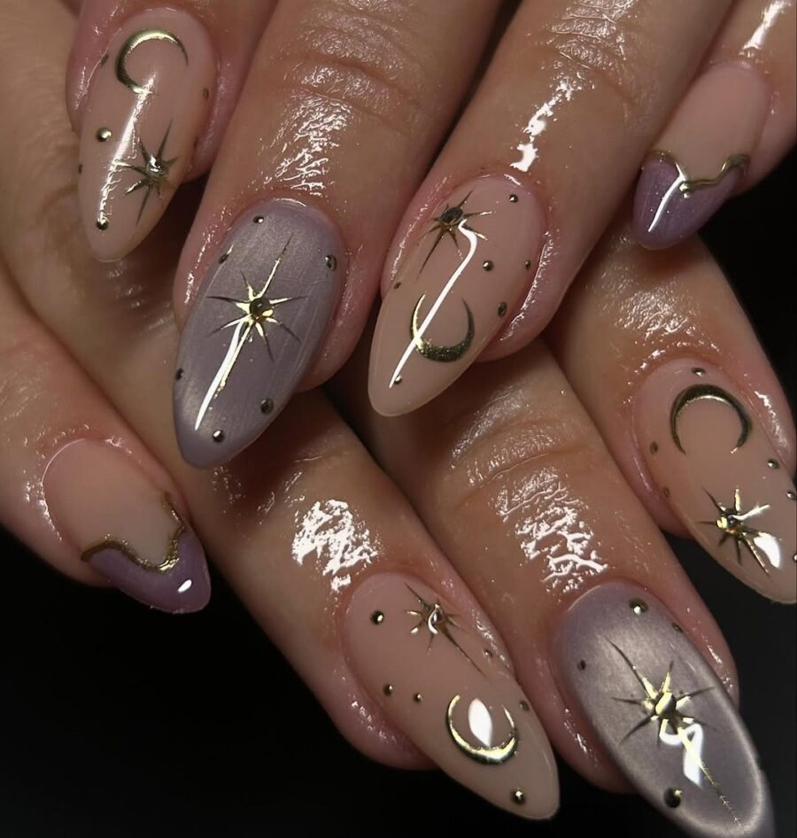 Celestial-inspired nails with golden accents