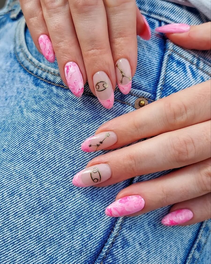 Vibrant pink zodiac nails with elegant designs