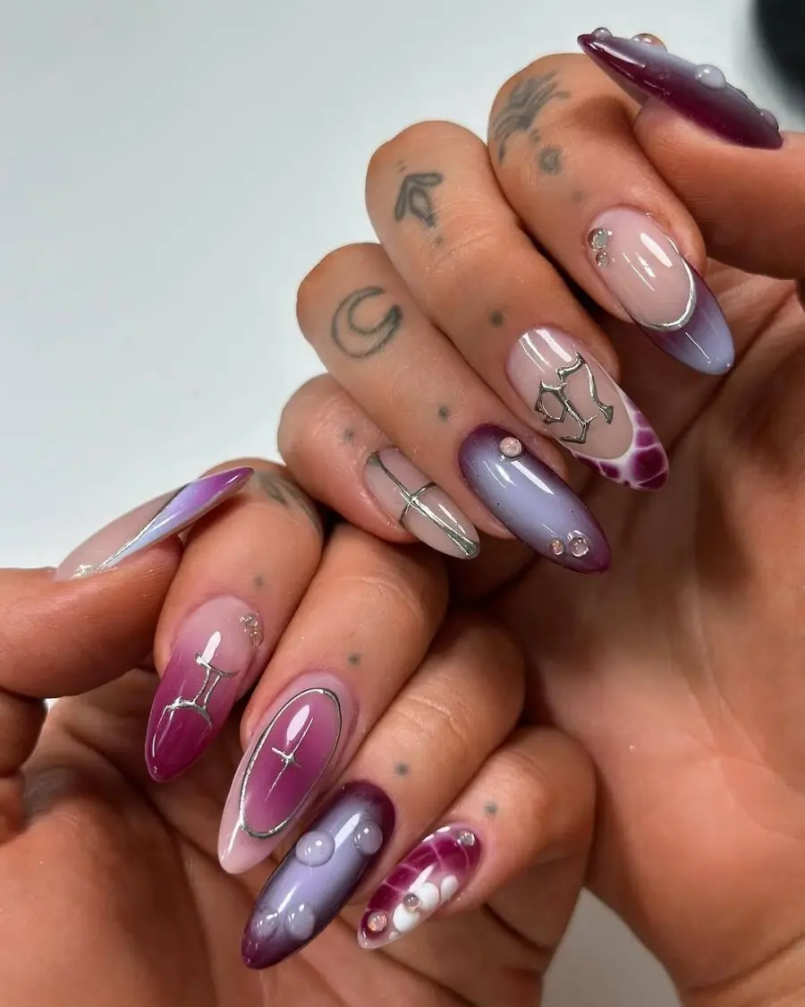 Astrological-themed purple ombre nail designs