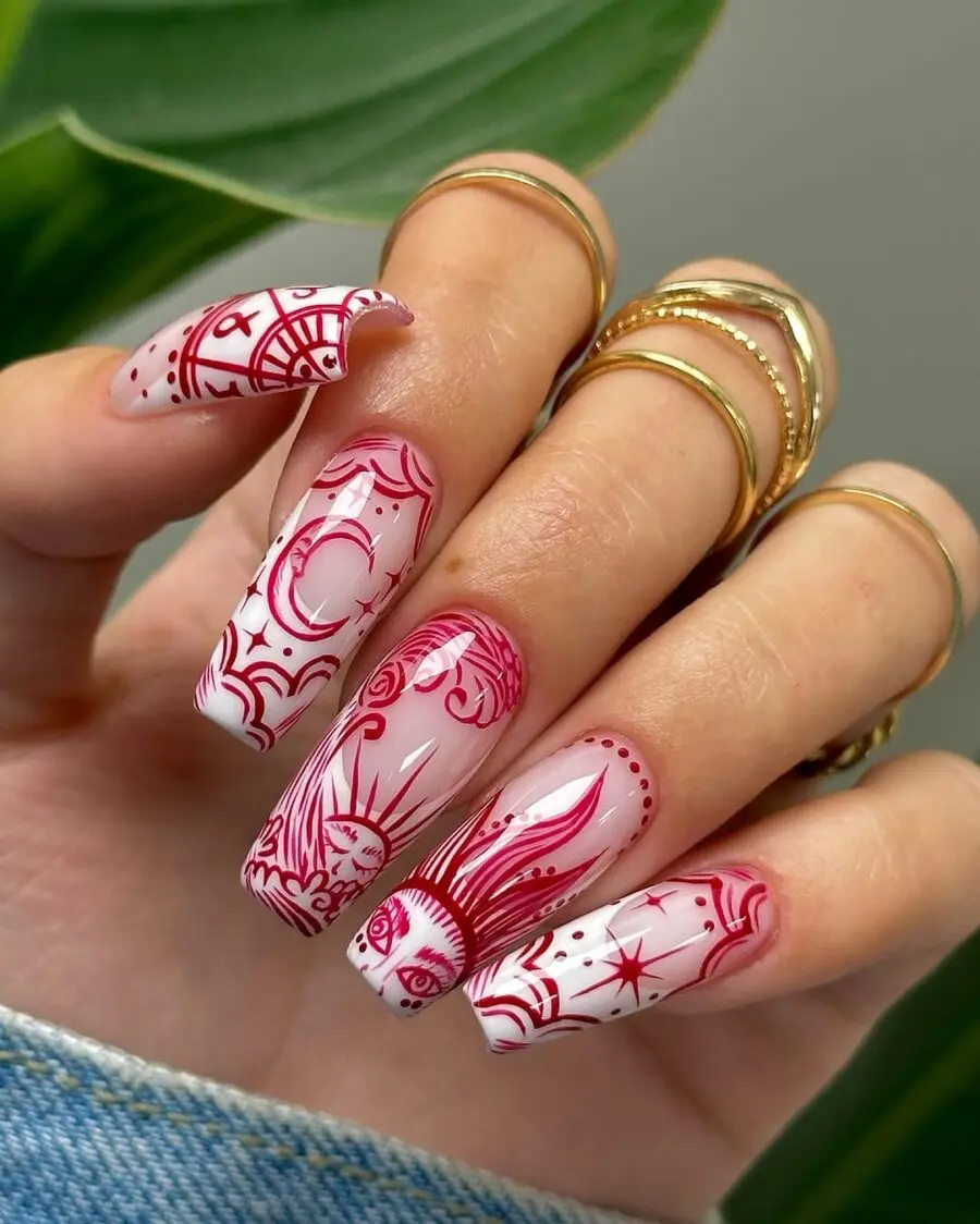 Elegant zodiac designs on stunning red nails