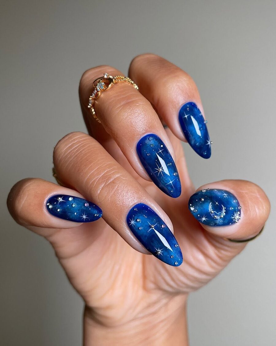 Celestial blue nails with starry designs