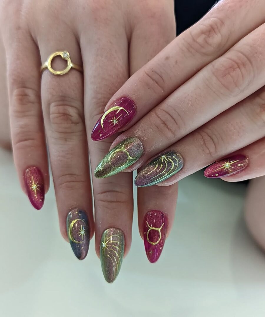 Celestial-inspired nails with vibrant cosmic elements
