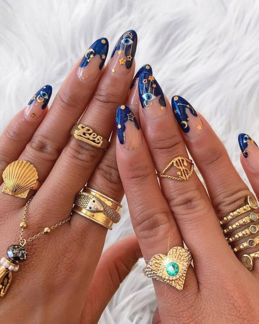 Celestial-themed zodiac nail art design