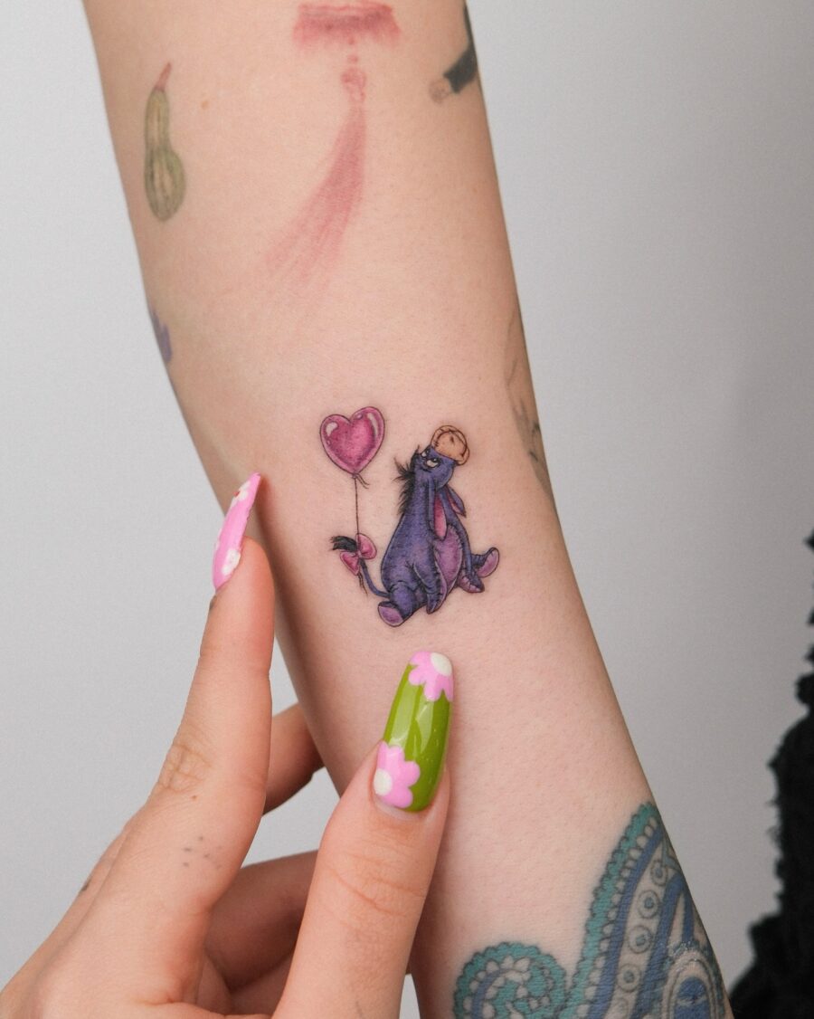 Charming Eeyore Tattoo with a Heart Balloon