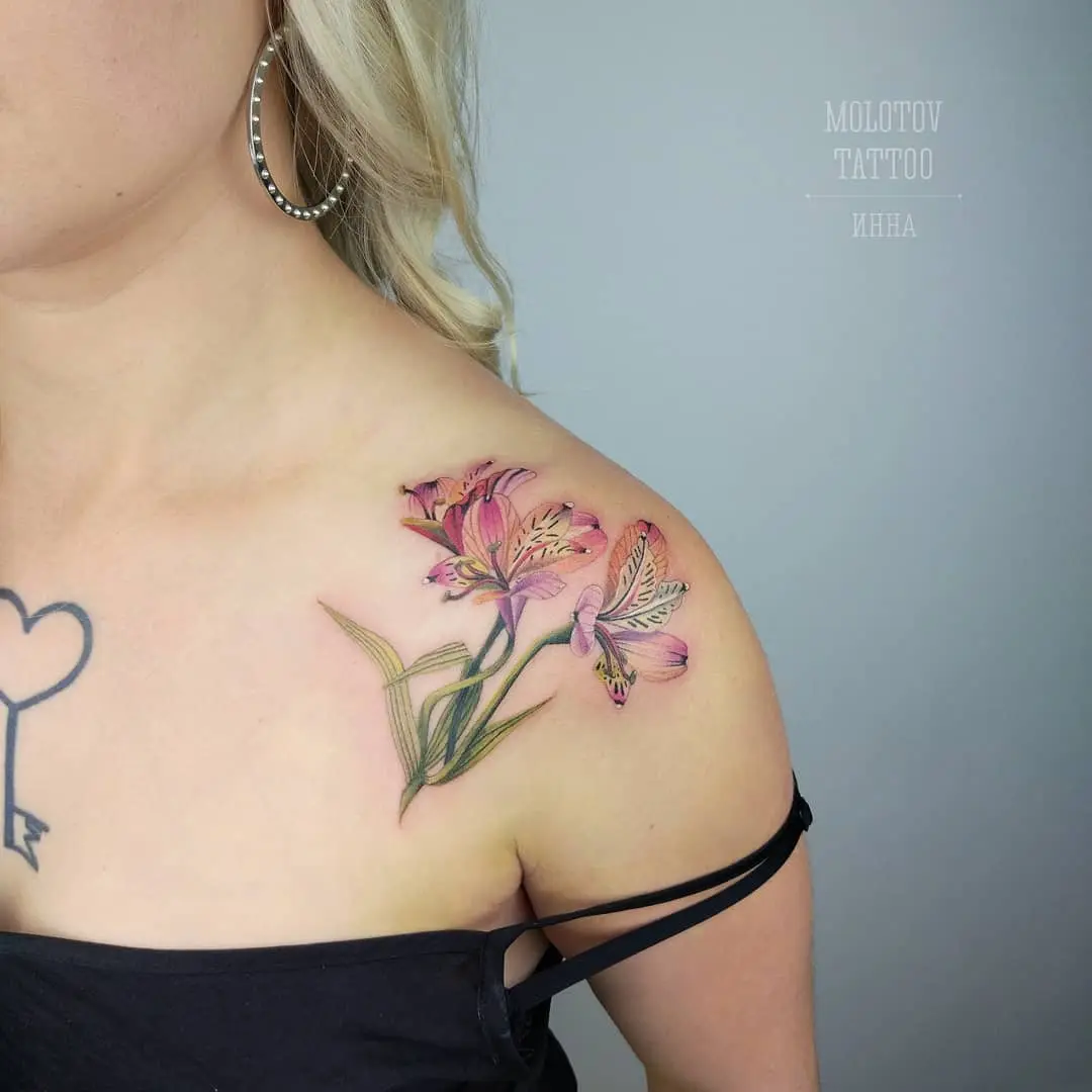 Vibrant alstroemeria tattoo on shoulder