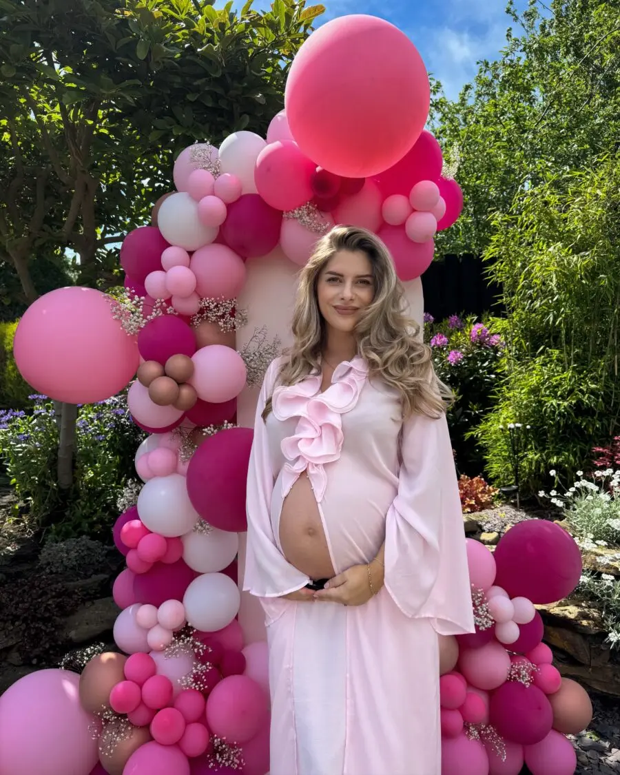 Stylish pink maternity outfit for baby shower