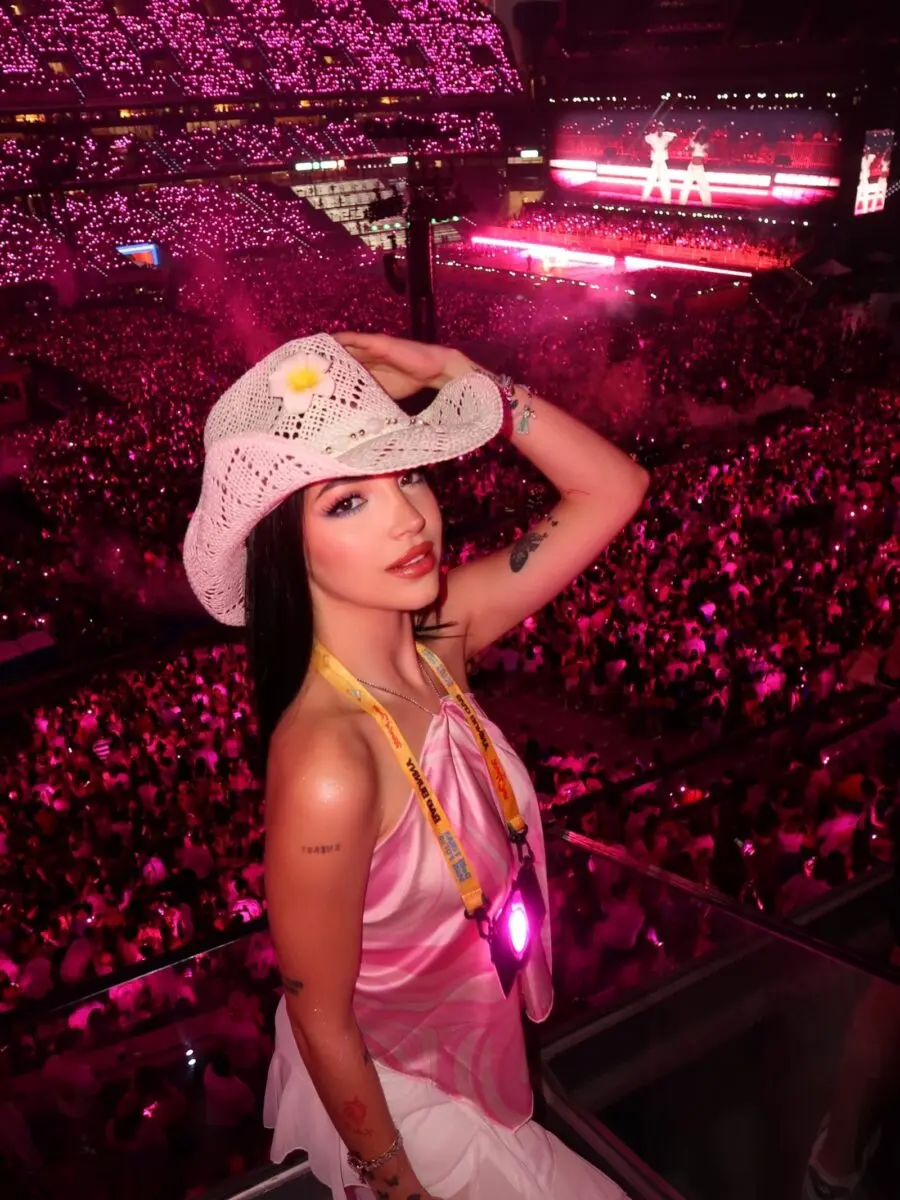 Chic Outfit Amidst Vibrant Concert Atmosphere