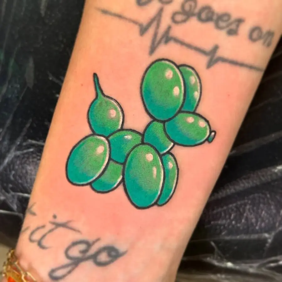 Playful balloon animal tattoo celebrating uniqueness