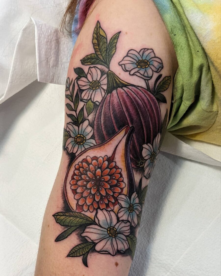 Vibrant floral bicep tattoo with intricate details