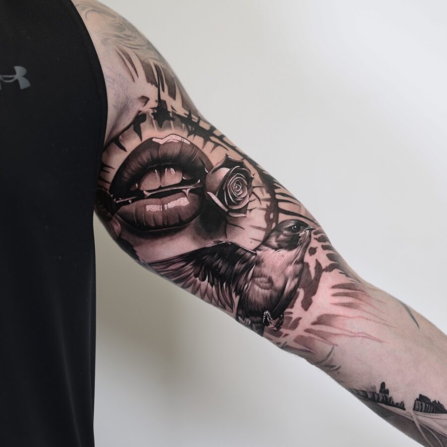 Striking blend of lips, bird, and rose tattoo