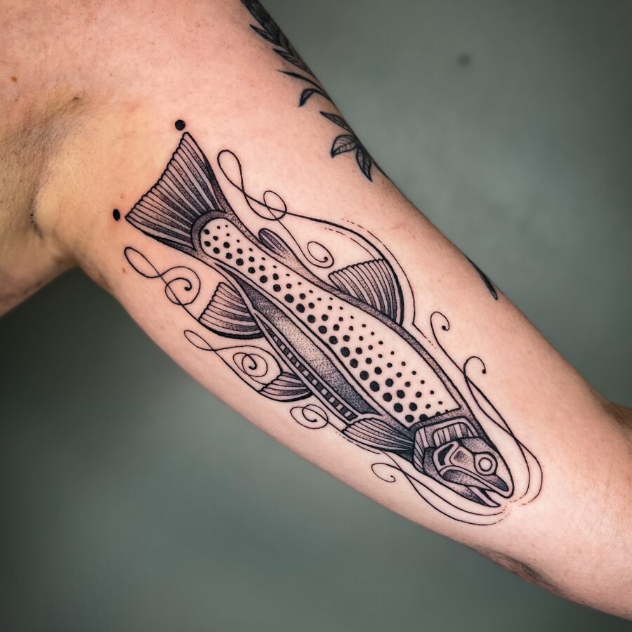 Stylish fish tattoo enhancing arm aesthetics