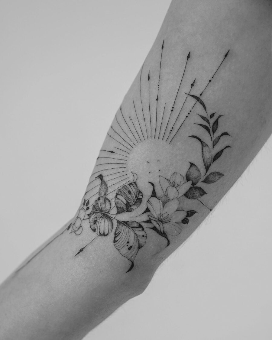 Stunning floral and sunray biceps tattoo design