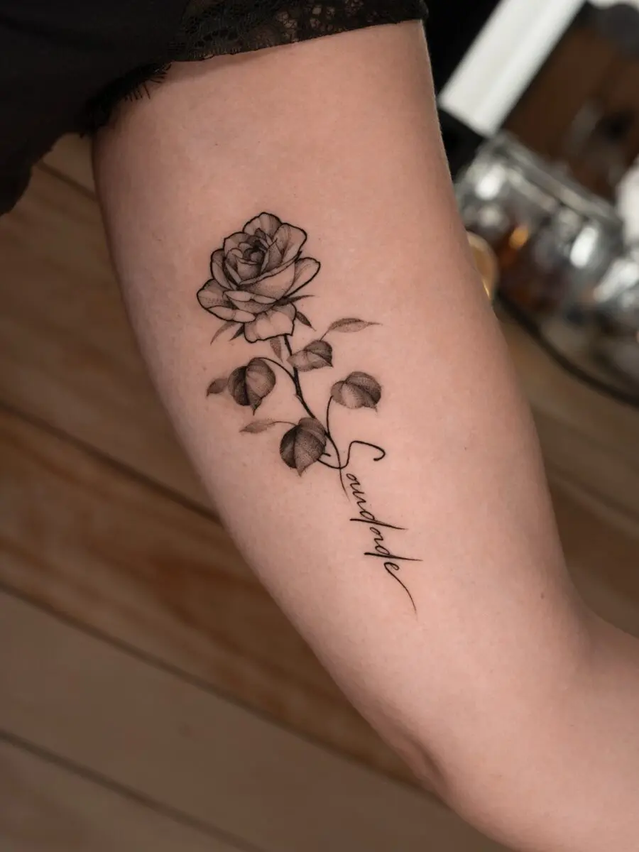 Elegant rose tattoo showcasing delicate artistry