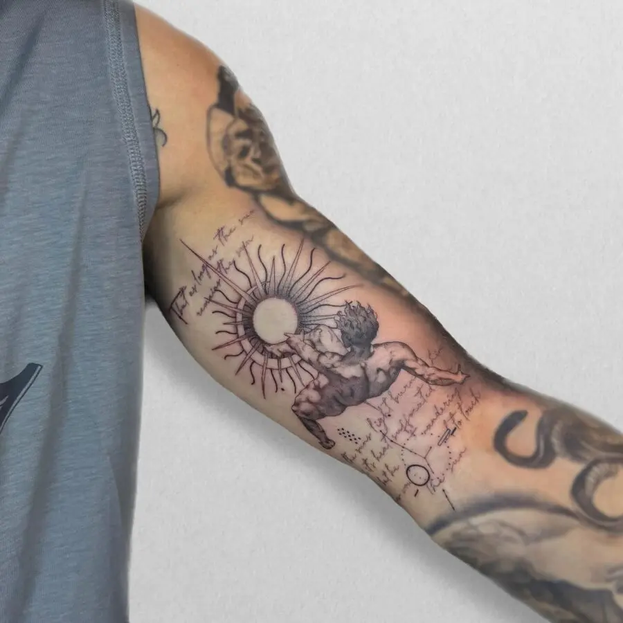 Intricate sun and figure design tattoo