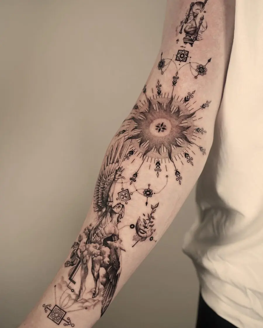 Eye-catching biceps tattoo with sun and phoenix