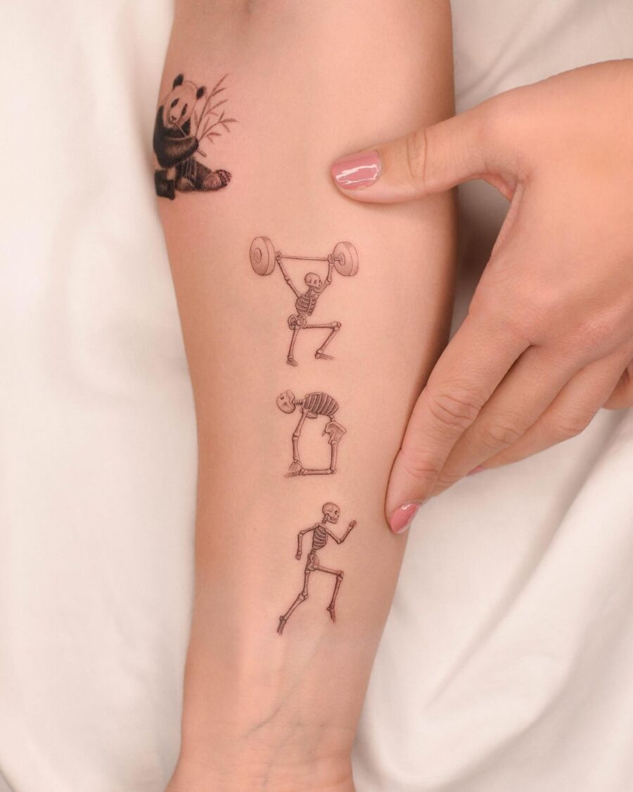 Whimsical Biceps Tattoo Art Featuring Skeletons