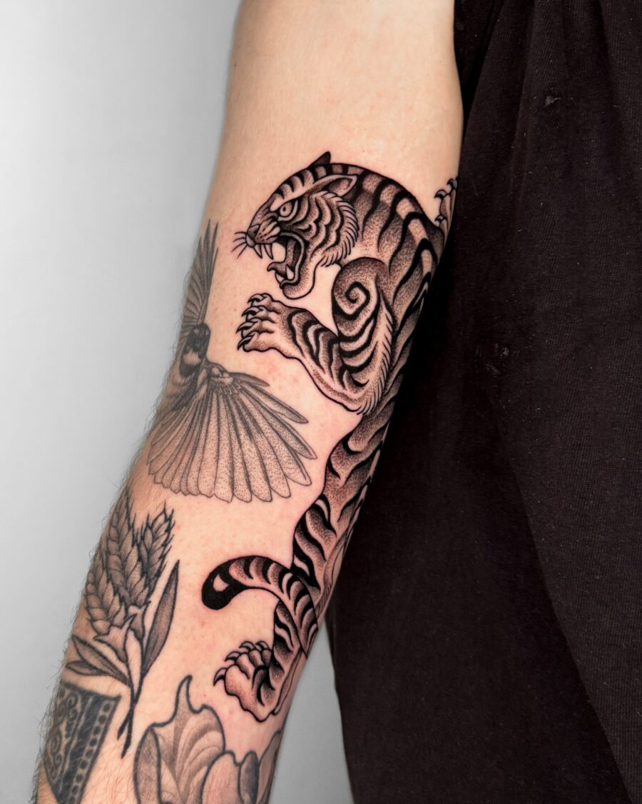Bold tiger tattoo showcasing sleek detailing