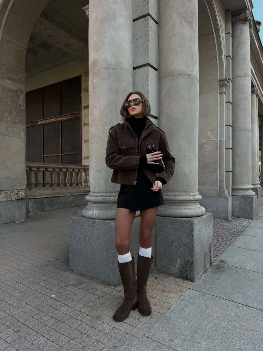 Chic biker boots outfit in urban setting