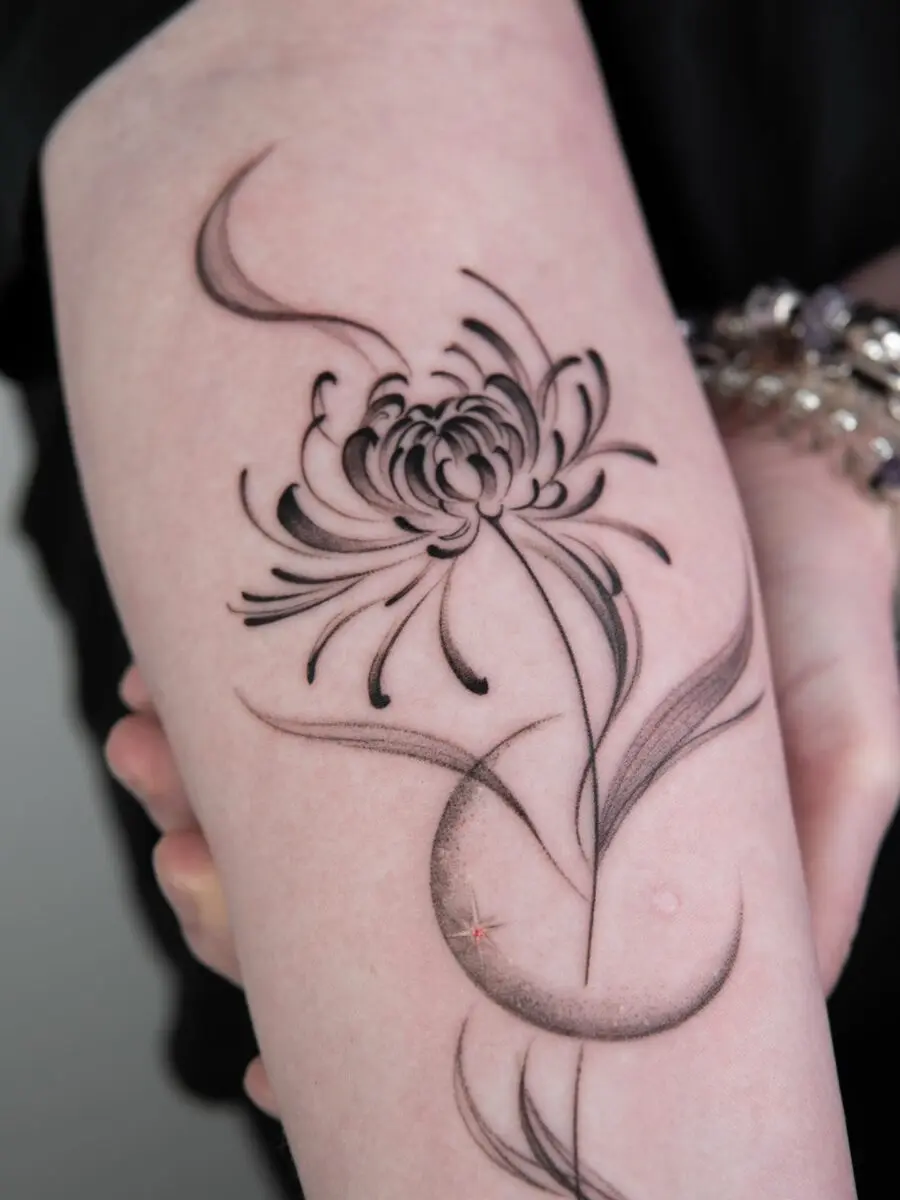 Elegant chrysanthemum tattoo with flowing lines