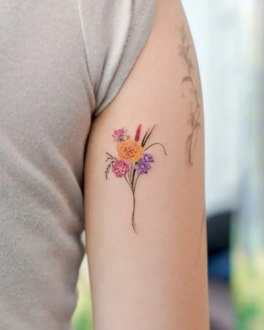 Vibrant floral birth flower tattoo on skin