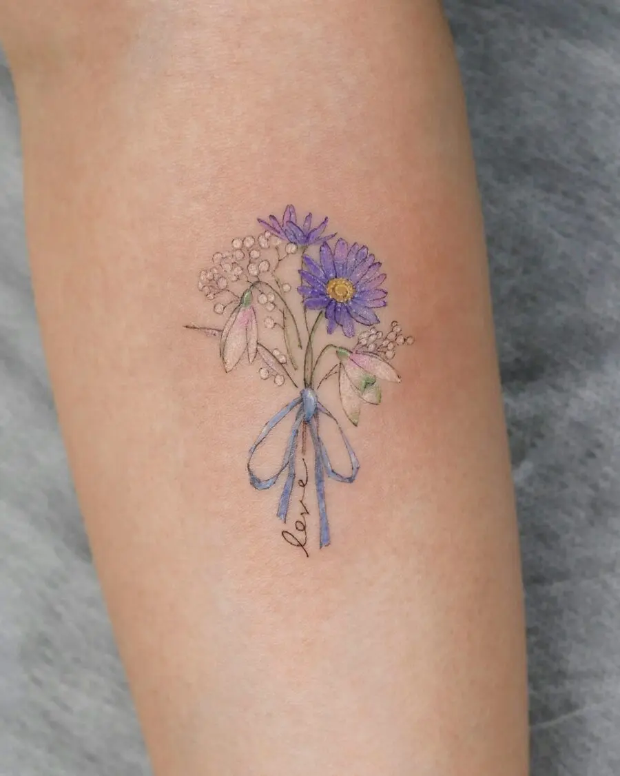 Delicate daisy tattoo with a charming bow