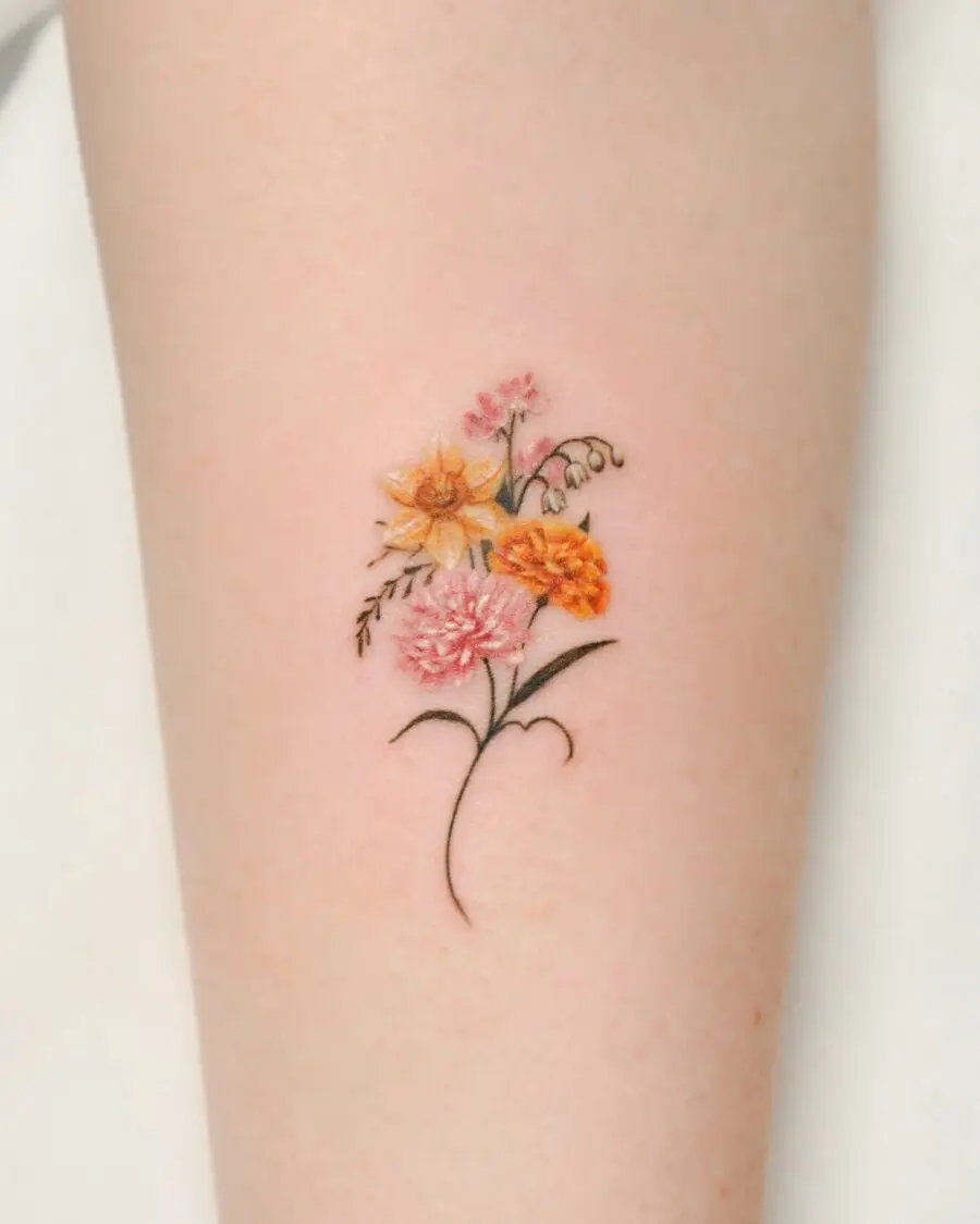 Colorful birth flower tattoo with delicate details