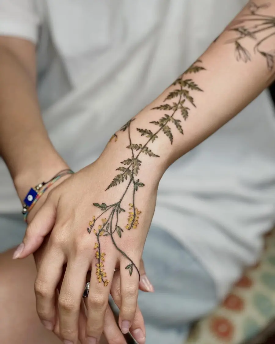 Intricate floral tattoo design on the arm