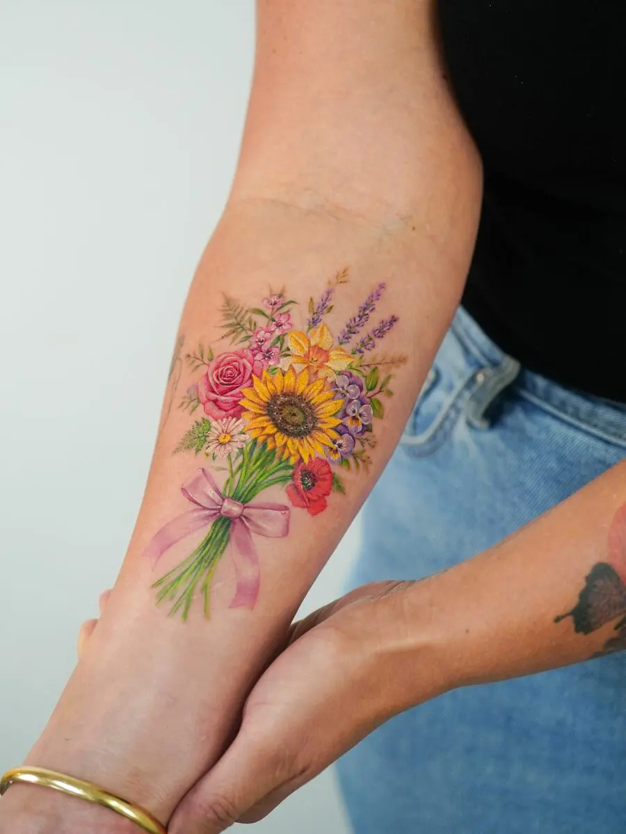 Colorful bouquet tattoo with vibrant blossoms