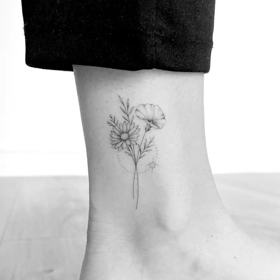 Elegant floral tattoo gracing the ankle